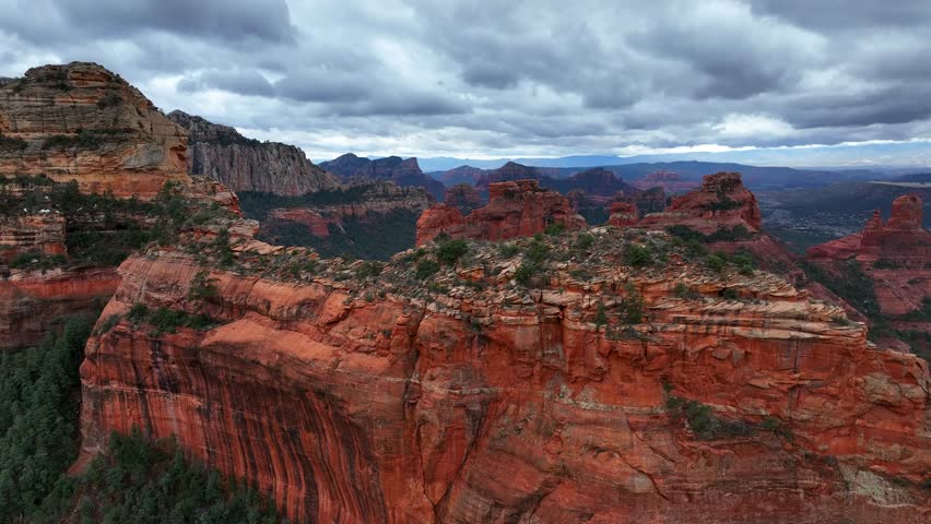 Aerial view of majestic rock formations and Oak Creek in a breathtaking canyon landscape, Sedona, Arizona, United States.