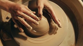 Woman potter works with clay on master class in studio. Working process in ceramic workshop. Potter making vase on pottery wheel. Handmade concept.  - Powered by Shutterstock - Get 15% off with code: PIKWIZARD15