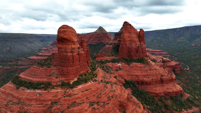 Aerial view of majestic rock formations and Oak Creek in a rugged landscape, Sedona, Arizona, United States.