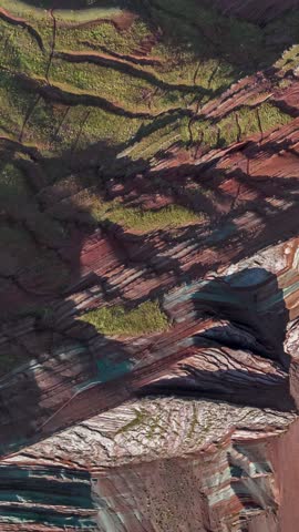 Rainbow Mountain, Peru. Also known as Cerro Colorado near to Cusco. Vertical video in aerial view.