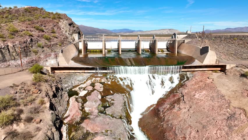 Aerial view of horseshoe reservoir reflecting the blue sky with surrounding mountains, Black Canyon City, Arizona, United States.