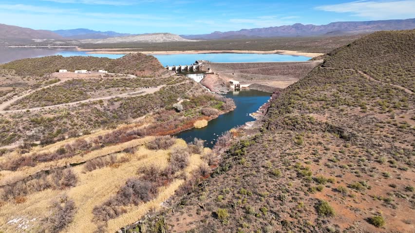 Aerial view of horseshoe reservoir and verde river surrounded by mountains and desert vegetation, Black Canyon City, Arizona, United States.