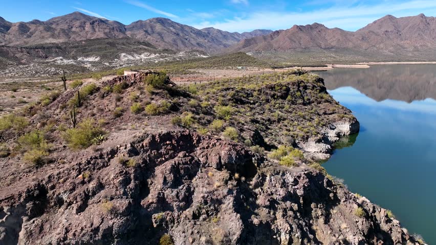 Aerial view of horseshoe reservoir and verde river surrounded by rugged mountains and tranquil desert landscape, Black Canyon City, Arizona, United States.