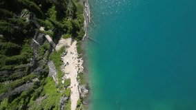 Lake with a blue water in the mountains surrounded with the trees in the morning with a little bit of fog and early sun rays - Powered by Shutterstock - Get 15% off with code: PIKWIZARD15
