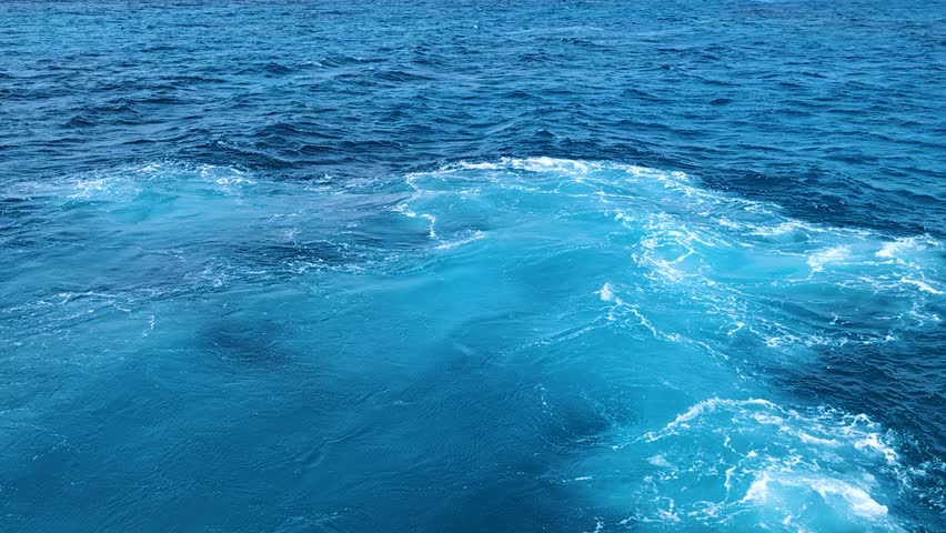Serene slow motion ocean scene with blue water texture background, deep turquoise blue with bright flowing foam streams, beautyful fresh summer landscape from happy sunny vacation, Warm sea Traveling