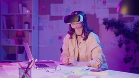 Immersive Learning, Virtual Education, Gen Z Style. Girl in VR or AR Glasses Studies in Neon Room, Exploring Interactive Content. Future-Focused Way of Learning Through Experience and Engagement - Powered by Shutterstock - Get 15% off with code: PIKWIZARD15