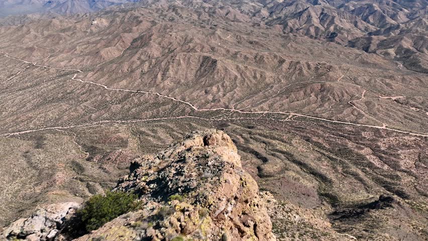 Aerial view of Apache Lake surrounded by majestic mountains and rugged terrain, Apache Junction, Arizona, United States.