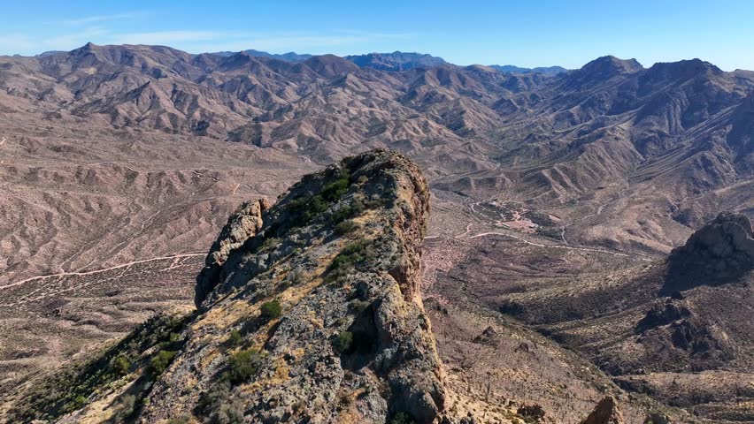 Aerial view of apache lake surrounded by rugged mountains and expansive desert landscape, apache trail, apache junction, arizona, united states.