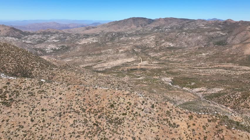 Aerial view of four peaks in the rugged landscape of Tonto National Forest, Apache Junction, Arizona, United States.