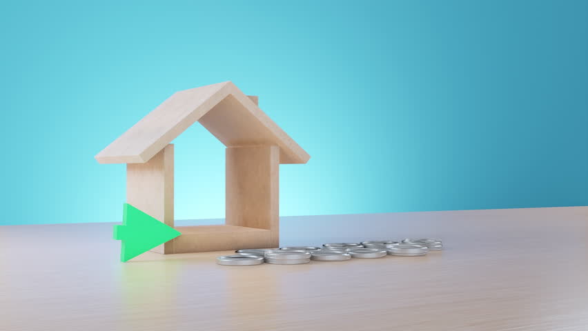 A visual representation of real estate investment growth featuring a wooden house model, stacks of silver coins, and a large green arrow pointing upward on a wooden surface.