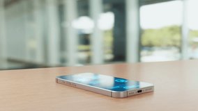 A smartphone on a table projects a futuristic holographic interface showing AI chat bubbles and icons for artificial intelligence conversation. - Powered by Shutterstock - Get 15% off with code: PIKWIZARD15