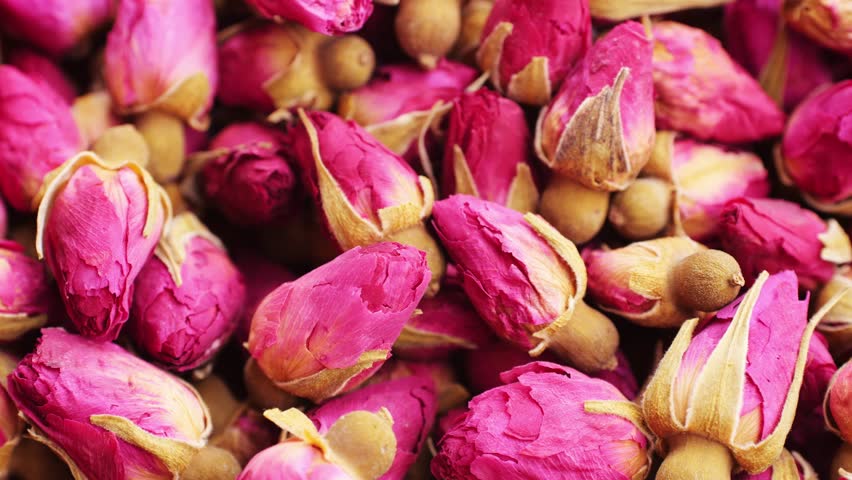 Dried rose bud tea texture background, Healthy herbal tea macro texture close up. 