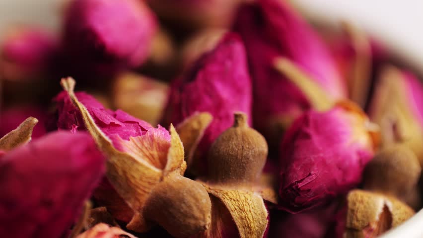 Dried rose bud tea texture background, Healthy herbal tea macro texture close up. 