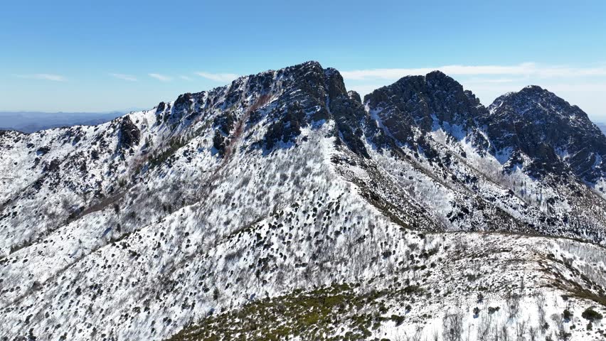 Aerial view of snow-covered Four Peaks in the serene Tonto National Forest, Mazatzal Mountains, Apache Junction, Arizona, United States.