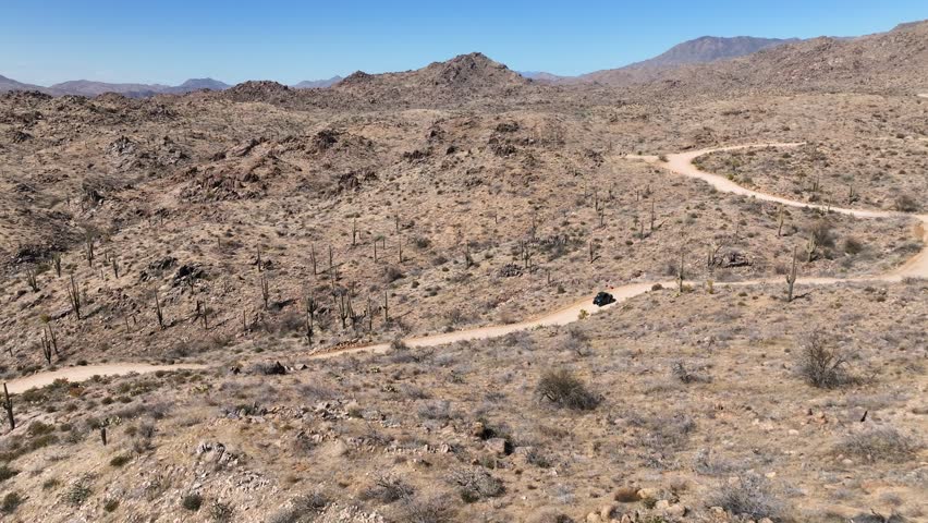 Aerial view of rugged desert landscape with cacti and mountains under a clear sky, Four Peaks, Tonto National Forest, Mazatzal Mountains, Arizona, United States.