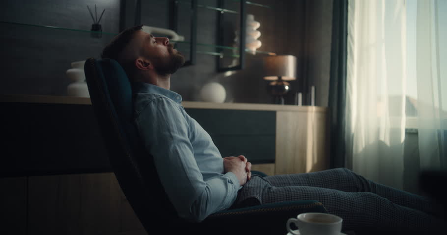 Professional Financial Expert Sitting in Chair with Closed Eyes, Resting After Work and Hard Trading Day. Successful Businessman in Comfortable Home Office or Investment Bank Office. Dolly Shot.