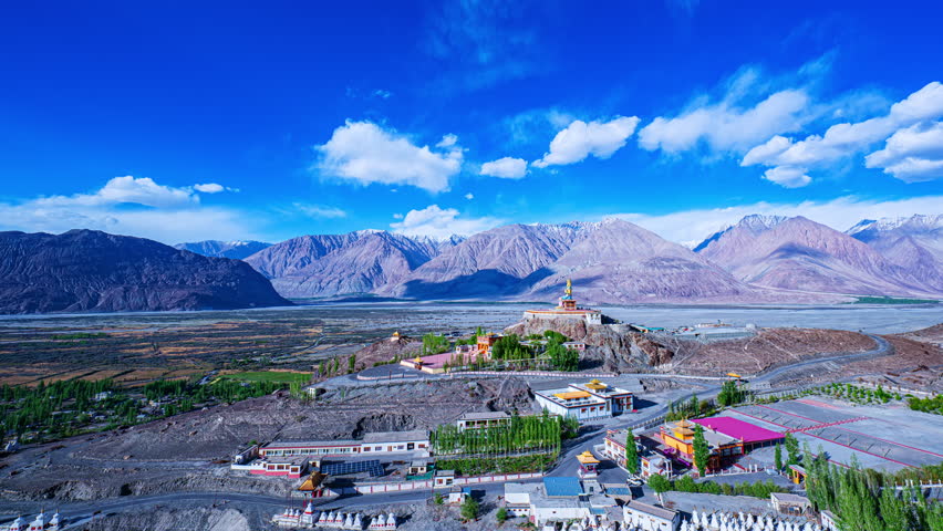 Timelapse A golden statue of Maitreya Buddha at Diskit Monastery also known as Diskit Gompa or Diskit Gompa is the oldest and largest Buddhist monastery in the Nubra Valley of Ladakh, northern India. - Powered by Shutterstock - Get 15% off with code: PIKWIZARD15