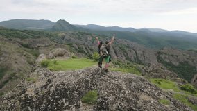 Aerial circular view victorious caucasian couple celebrating together arms up achievement climb on mountain summit, arms raised in victory, symbolizing success, unity, and goal accomplishment outdoors - Powered by Shutterstock - Get 15% off with code: PIKWIZARD15