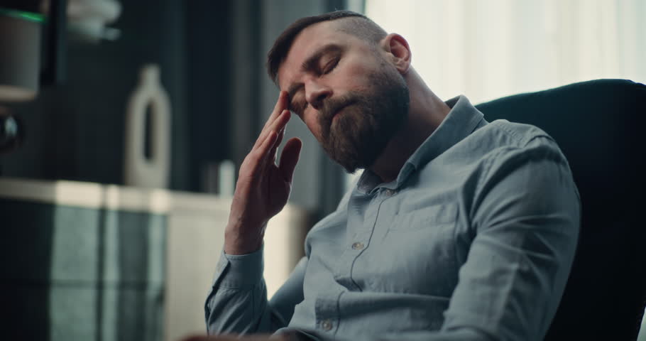 Sad Professional Stock Exchange Trader Monitoring Real-Time Stocks and Exchange Market Charts on Laptop, Suffering from Financial Crisis. Investment Agent Stressed About Sudden Stock Market Collapse.