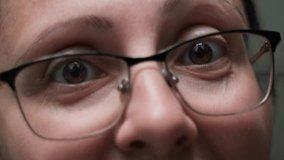 Close-Up of Woman’s Face Emotionally Arguing With Raised Eyebrows and Direct Eye Contact Through Glasses - Powered by Shutterstock - Get 15% off with code: PIKWIZARD15