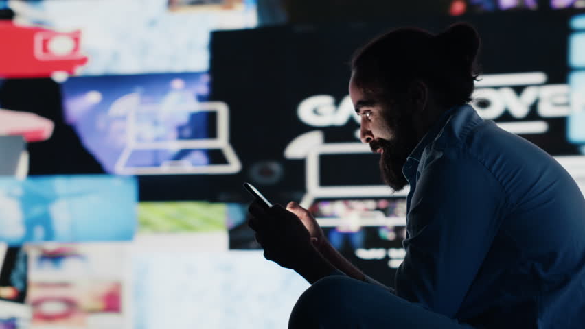 Stressed individual obsessively overuses his mobile phone social apps, illustrating the mental health crisis driven by addiction and excessive information. Cyberbullying and manipulation. Camera A.