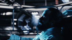 Unhappy cosmonaut sighs, having mental health affected by prolonged solitude. Depressed astronaut sits on orbit station floor in silence after weeks without contact in isolated space habitat, camera B - Powered by Shutterstock - Get 15% off with code: PIKWIZARD15