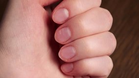 Woman filing nails in slow motion close up - Powered by Shutterstock - Get 15% off with code: PIKWIZARD15