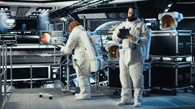 Cosmonaut verifying navigation coordinates on tablet in spaceship during mankind survival expedition. Astronauts calibrating sensors, verifying human expansion in space mission parameters, camera A - Powered by Shutterstock - Get 15% off with code: PIKWIZARD15