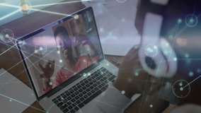 Man lowering headphones at desk initiating tech call connecting to woman waving via network overlay. Technology, communication, remote work, digital, networking, collaboration, modern - Powered by Shutterstock - Get 15% off with code: PIKWIZARD15