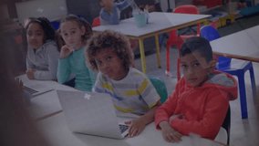 Curly boy shifting and glancing at teacher activating transparent hologram enriching lesson. Technology, education, innovation, digital, classroom, youthful, interactive - Powered by Shutterstock - Get 15% off with code: PIKWIZARD15