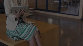 Business analyst tapping tablet and revealing financial charts tracking market fluctuations. Professional, analytical, modern, corporate, digital, data, workplace - Powered by Shutterstock - Get 15% off with code: PIKWIZARD15