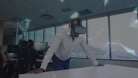 Mature man entering tech office and wearing VR headset, activating digital network analyzing data. Futuristic, innovation, collaboration, digital, immersive, workspace, networking - Powered by Shutterstock - Get 15% off with code: PIKWIZARD15