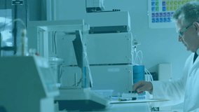 Scientist loading vial into chromatograph and entering settings and analyzing global data overlay. Research, innovation, data, exploration, technology, precision, analytics - Powered by Shutterstock - Get 15% off with code: PIKWIZARD15