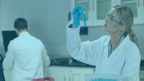 Female scientist lifting test tube, initiating holographic charts and rotating globe for analysis. Laboratory, innovation, futuristic, research, analysis, technology, collaboration - Powered by Shutterstock - Get 15% off with code: PIKWIZARD15