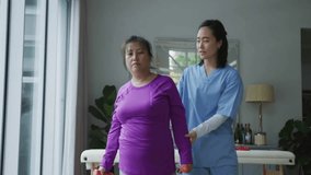 Patient lifting dumbbell as therapist placing hands under arm, floating counters drifting for rehab. Fitness, physiotherapy, rehabilitation, physical therapy, wellness, support, movement - Powered by Shutterstock - Get 15% off with code: PIKWIZARD15