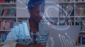 Student studying and typing on laptop upon holographic bar graphs appearing enhancing study. Education, technology, innovation, learning, digital, focus, library - Powered by Shutterstock - Get 15% off with code: PIKWIZARD15