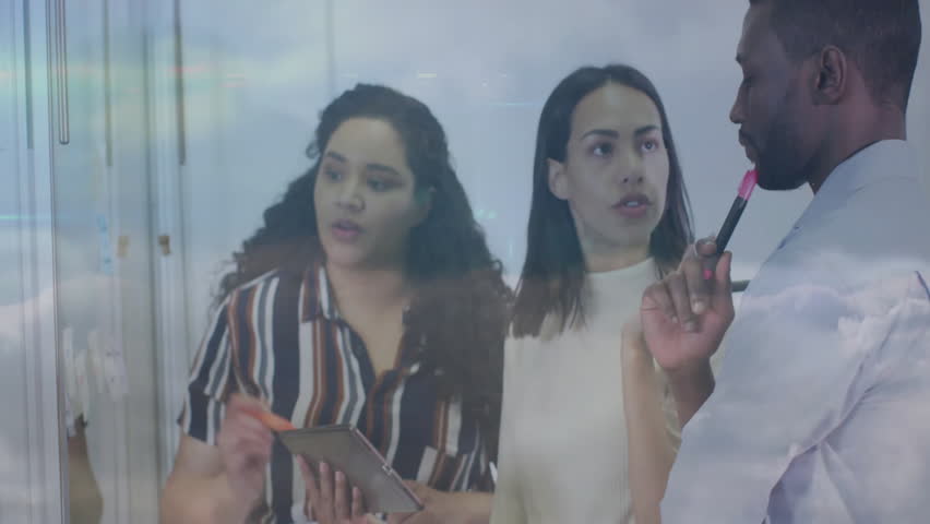 Three colleagues tapping tablet, writing on board, overlay network icons moving for business pitch. Collaboration, innovation, teamwork, data analysis, digital technology, modern office, strategic - Powered by Shutterstock - Get 15% off with code: PIKWIZARD15