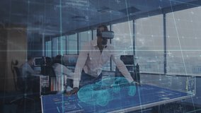 Male engineer donning VR headset, touching tech table activating 3D car model for examining layers. Futuristic, collaboration, innovation, technology, digital, professional, sleek - Powered by Shutterstock - Get 15% off with code: PIKWIZARD15