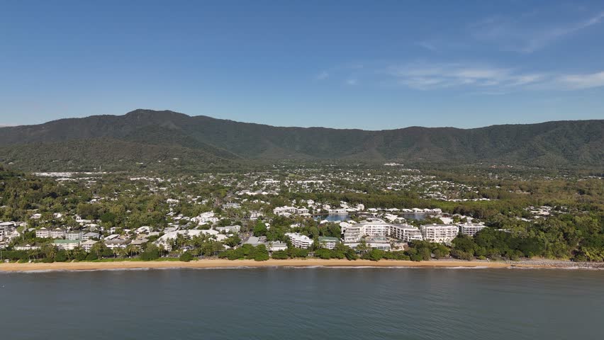 Trinity Beach, Cairns, Queensland: 4K Aerial Drone Footage Featuring Scenic Shoreline, Taylor Point, Coral Sea, Palm Fringed Town, Coastal Hotels, and Lush Tropical Forest Along Australia Coast