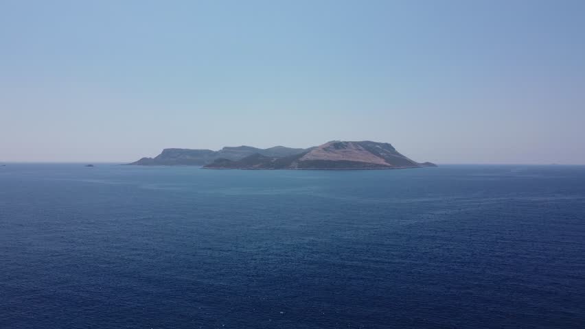 Aerial view of island in the middle of the blue sea