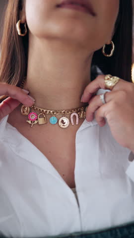 Hands, woman and fashion with designer necklace for getting ready, quality check and styling. Female person, custom trinket and jewellery to advertise brand, charm accessories and statement piece