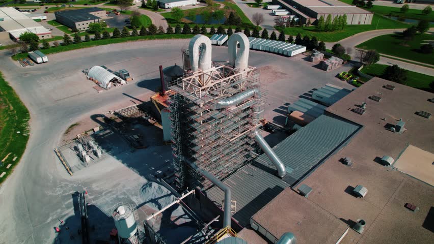 Industrial facility featuring processing towers, silos, and heavy machinery in North Wisconsin.
