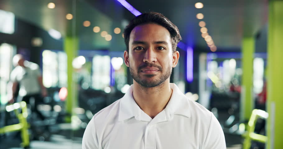 Happy, asian man and face with gym manager in confidence for health and wellness service. Portrait, male person and instructor with smile in joy for vitality, exercise or workout at fitness facility