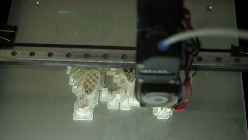 A 3D printer machine that creates a three-dimensional geometric shape. The workflow of printing on a 3d printer. Modern automatic production technology, beautiful 3d animation.