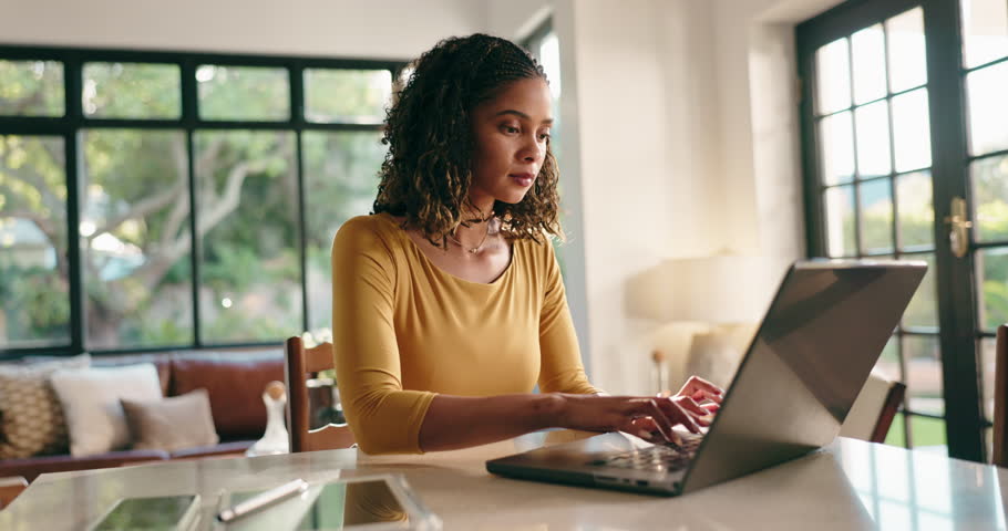 Woman, laptop and typing with remote work from home, project management and review in living room. Person, writer and computer with click, feedback and editing process for freelance job at house