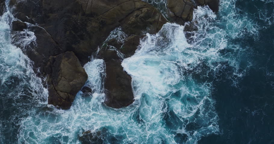 Amazing sea waves crashing on seashore and rocks seascape,Aerial view drone 4k High quality of ocean Slow motion waves background