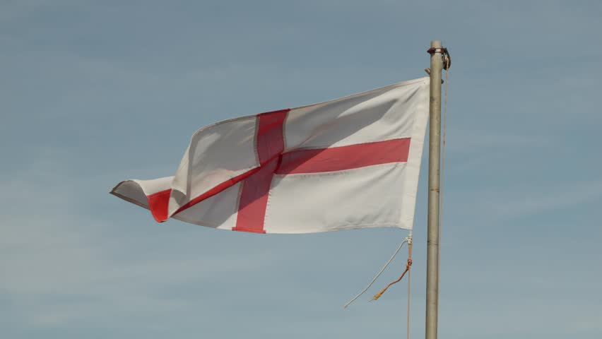 St. George flag and pole blowing in the wind slow motion stock footage