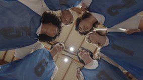 Female basketball team celebrating victory in locker room - Powered by Shutterstock - Get 15% off with code: PIKWIZARD15