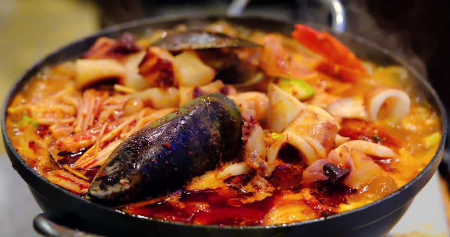steaming Korean seafood hot pot filled with a rich variety of seafood and spicy broth