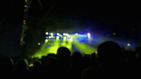 Defocused video of people enjoying vibrant dance party under colorful stage lights at night - Powered by Shutterstock - Get 15% off with code: PIKWIZARD15